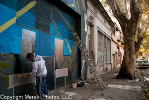 Photo of graffiti artist at work