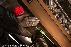 Photos of statue holding rose