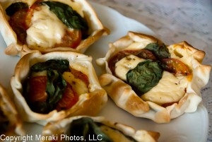 Photo of cooked caprese empanadas